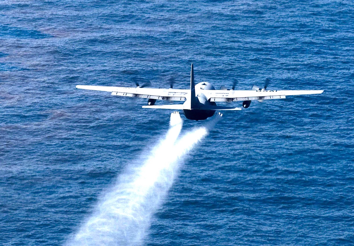 Military aircraft drops an oil-dispersing chemical into the Gulf of Mexico May 5, 2010, as part of the Deepwater Horizon Response effort. (U.S. Air Force photo/Tech. Sgt. Adrian Cadiz)