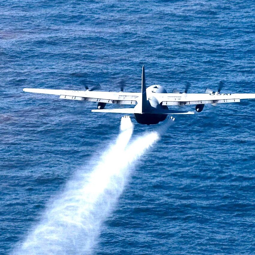 Military aircraft drops toxic oil-dispersing chemicals into the Gulf of Mexico May 5, 2010, as part of the Deepwater Horizon Response effort. (U.S. Air Force photo/Tech. Sgt. Adrian Cadiz)